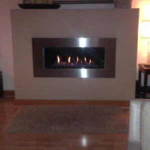 Contemporary gas fireplace with stainless steel front
